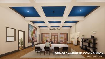 A spacious room at Waterstone at Big Creek featuring two comfortable couches, expansive windows that flood the space with natural light, and stylish tile floors, creating a welcoming and bright atmosphere.